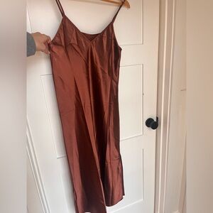 Classic satin slip dress in copper. Midi length.